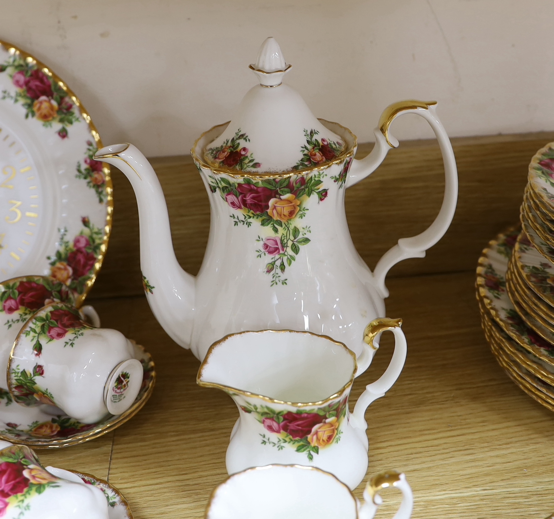 A Royal Albert Old Country Rose dinner service and tea service including trios, tureens and oval dishes